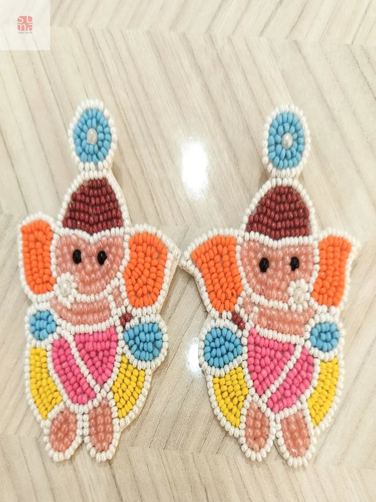 Colourful and Spiritual Charm Ganesha Drop Earrings Supermacchi Jewellery Collections