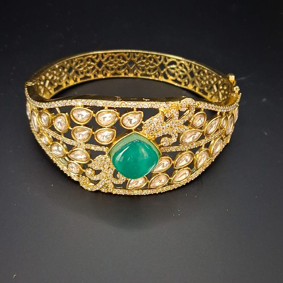 Gold bracelet with a green gemstone from Super Macchi
