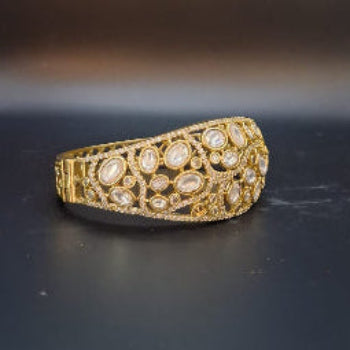 Gold bracelet with embedded stones 