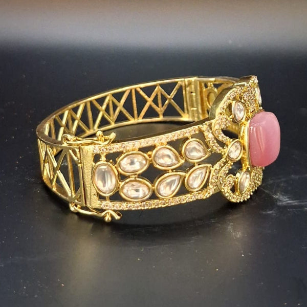 Gold bracelet with pink stone 