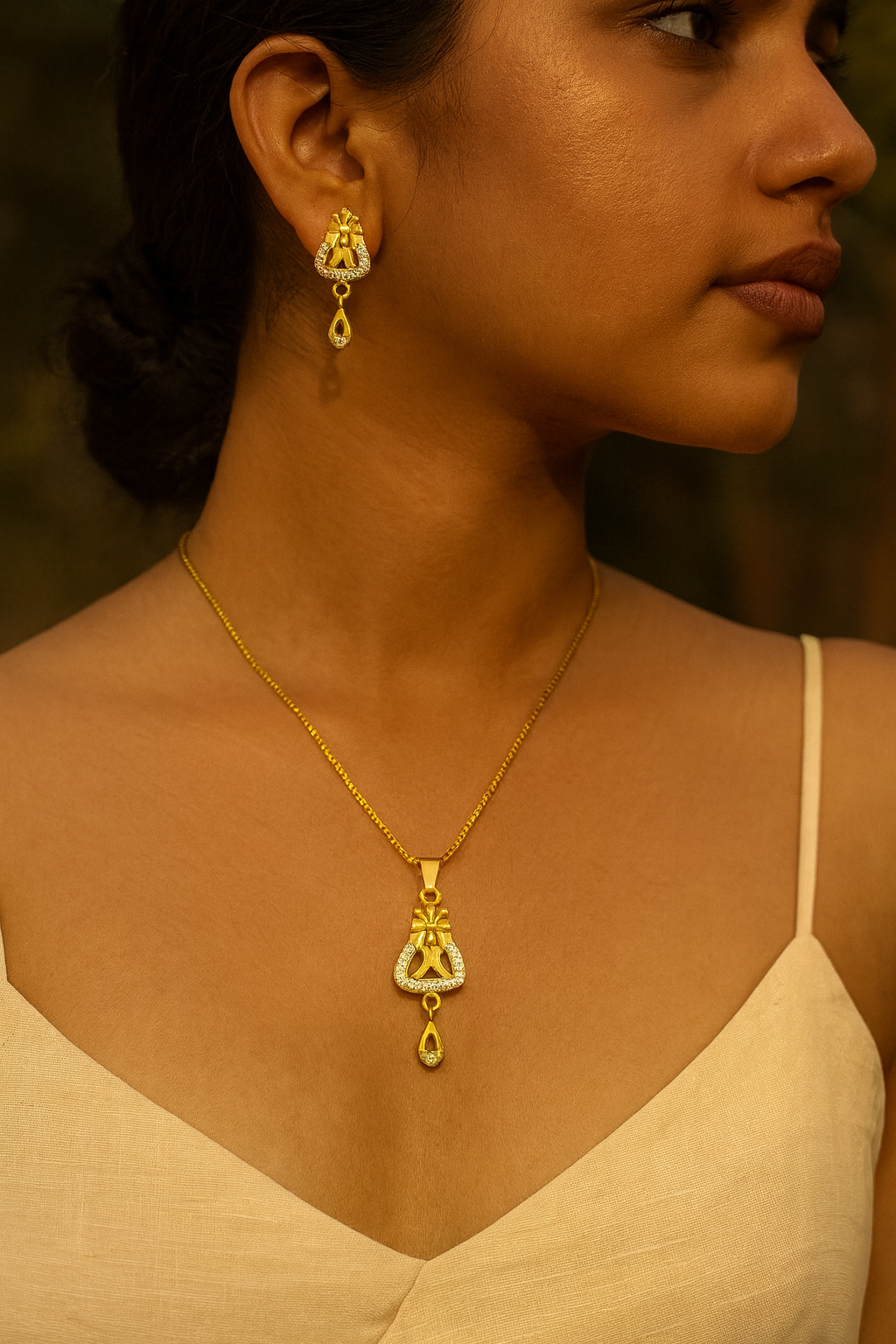 Super Macchi’s Demi-fine chain with pendant and matching earrings.